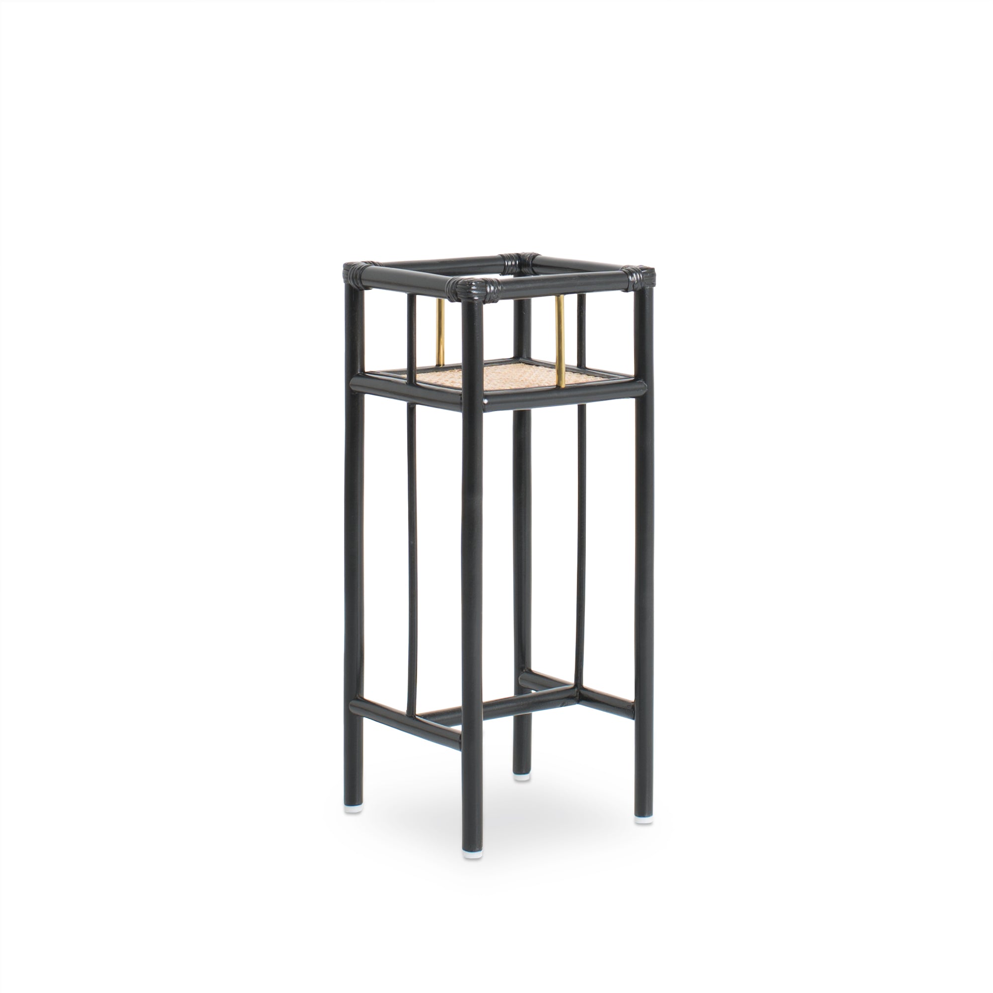 Modern black rattan planter featuring a sturdy frame and natural texture, perfect for housing your favorite plants. Designed with simplicity in mind, it adds a touch of warmth and elegance to any space. Created with eco-friendly materials, this piece blends sustainability with style. Designed in Singapore.