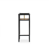 Modern black rattan planter featuring a sturdy frame and natural texture, perfect for housing your favorite plants. Designed with simplicity in mind, it adds a touch of warmth and elegance to any space. Created with eco-friendly materials, this piece blends sustainability with style. Designed in Singapore.