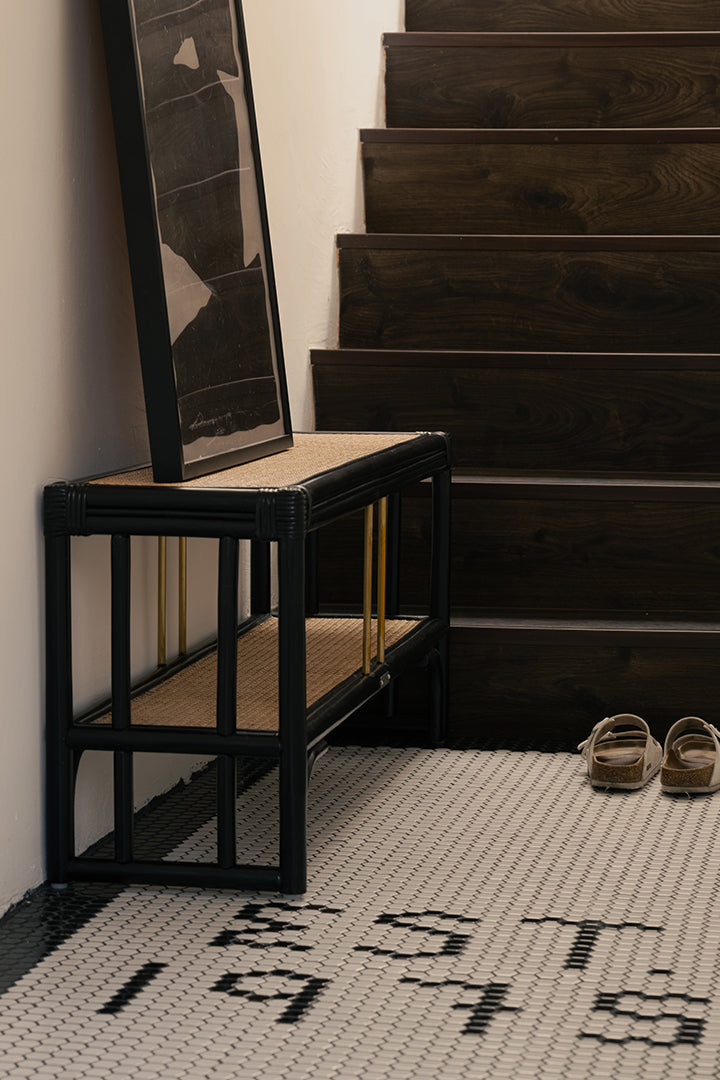 Black rattan shoe bench with an open-concept, double-layer design, offering ample storage for shoes and more. Designed in Singapore, it seamlessly blends natural elegance with functionality, perfect for modern entryways.