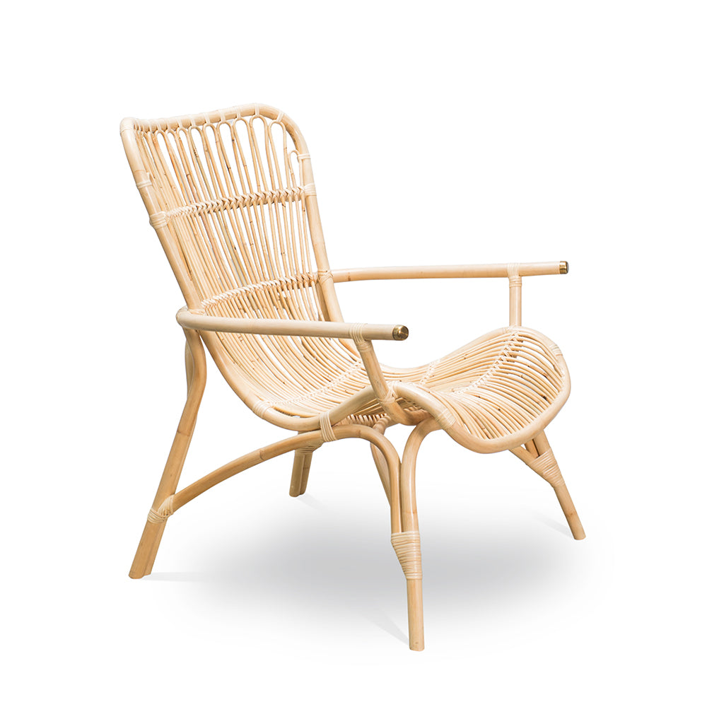 Handcrafted with natural rattan, this nostalgic cane chair brings timeless charm to any space. Designed in Singapore, it showcases artisanal craftsmanship with an airy frame and warm textures, perfect for relaxed living.