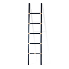 Designed in Singapore, this handcrafted black cane ladder showcases the beauty of rattan with a modern touch. Its sleek silhouette makes it a stylish, functional accent for any space, perfect for displaying throws, magazines, or decor with effortless charm. One of Nature Native's best-loved pieces.