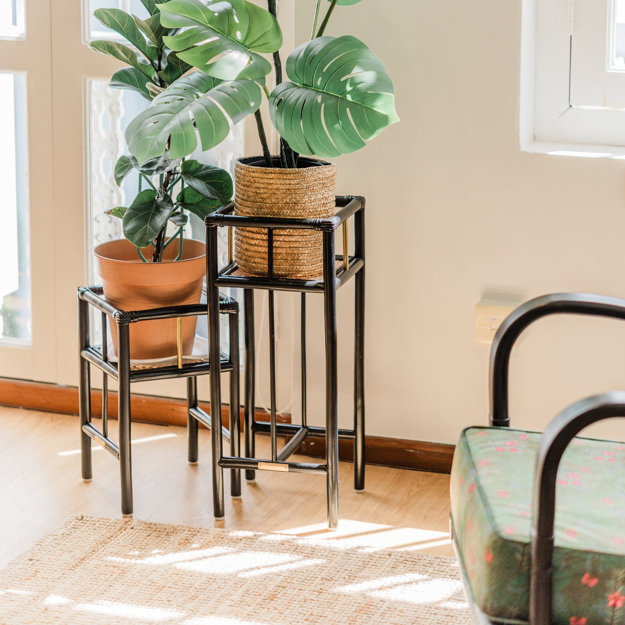 BROOK Planters made of cane and rattan featuring brass details in a light filled shophouse in Singapore