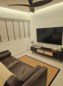 Custom MYRA Sisal Carpet in Coal Black in a living room