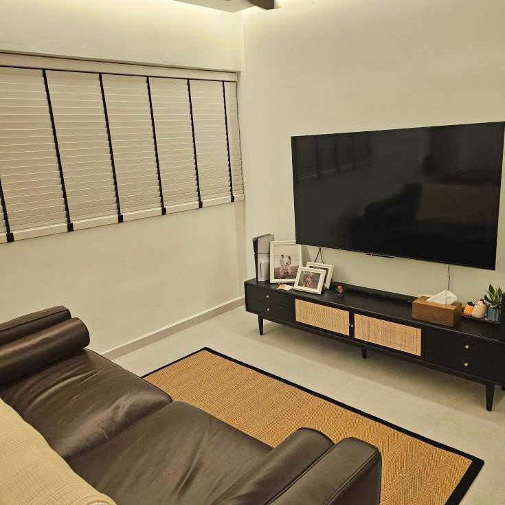 Custom MYRA Sisal Carpet in Coal Black in a living room
