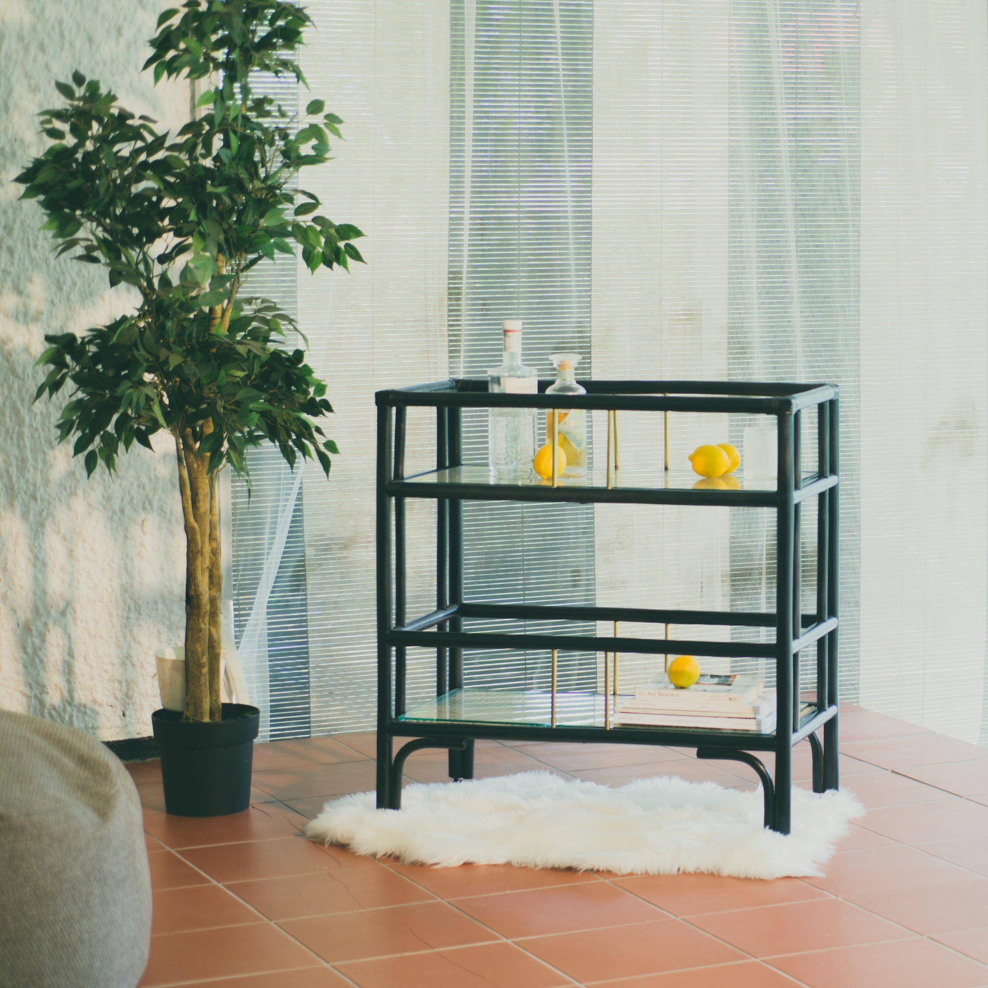 Elegant black rattan bar cart designed in Singapore, showcasing a minimalist aesthetic. Features two spacious tiers perfect for serving, storage, or styling in modern and functional living spaces.