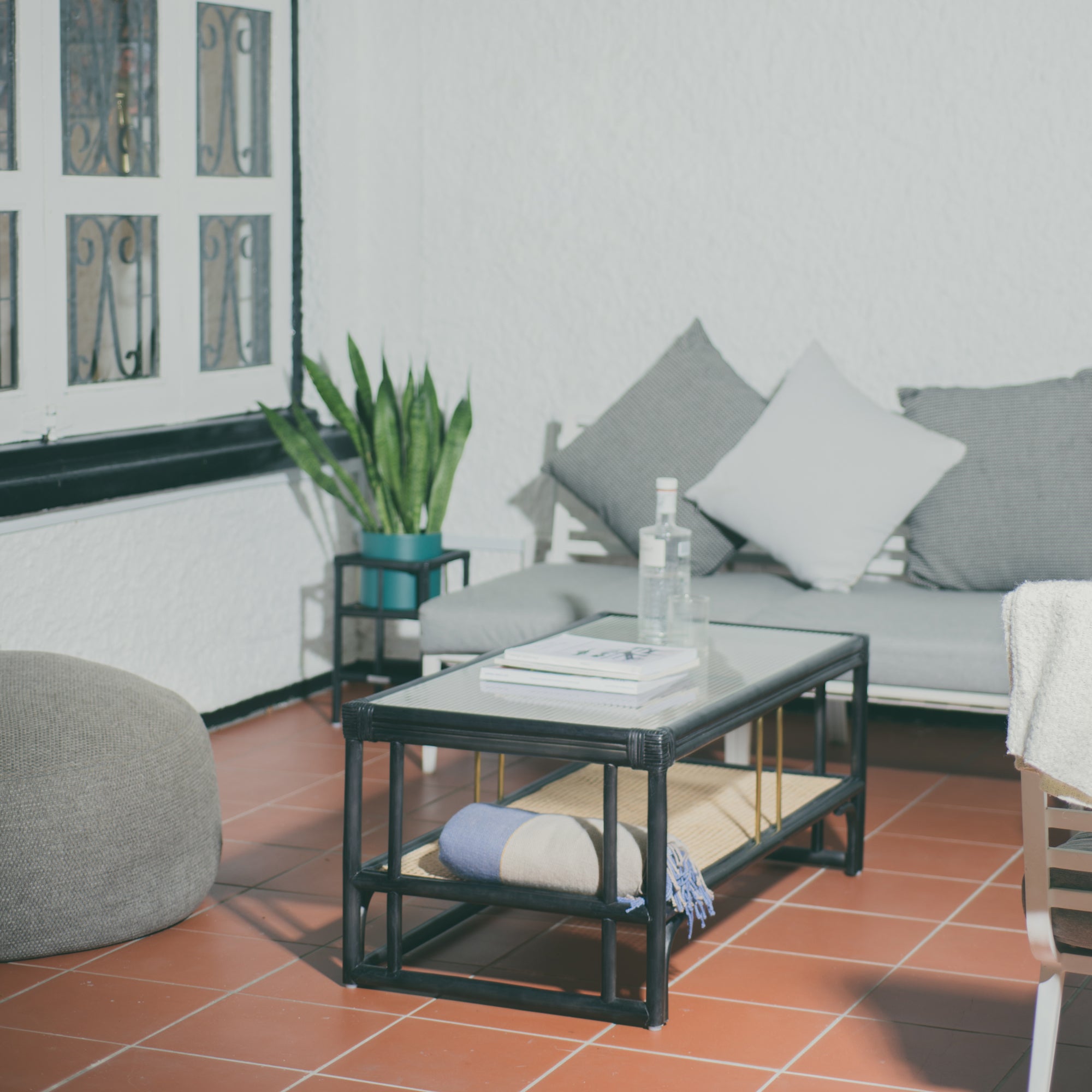 Stylish black rattan coffee table featuring a durable design with natural textures. Perfect for adding a touch of sophistication and warmth to any living space. Designed in Singapore, combining modern aesthetics with natural elements.