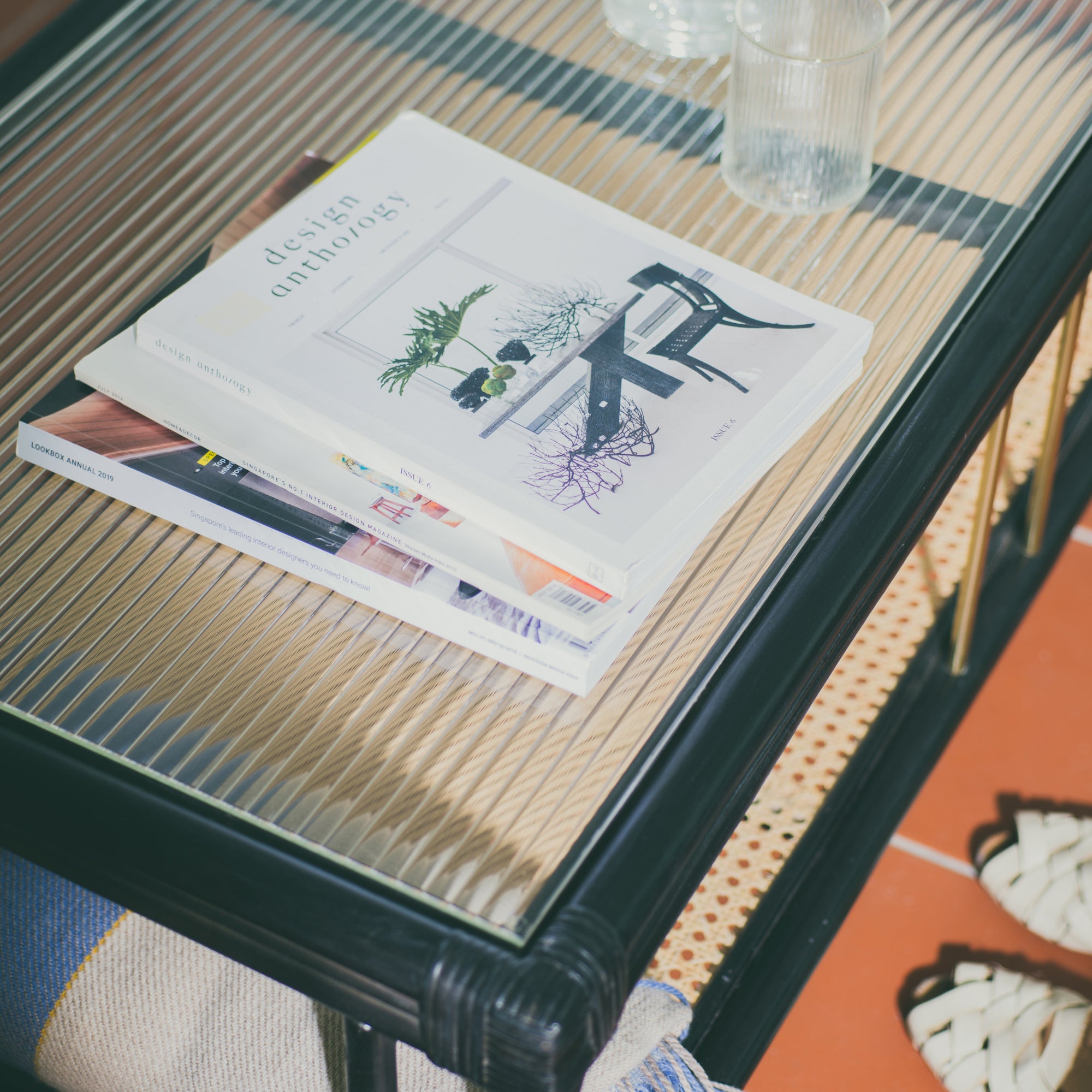 Stylish black rattan coffee table featuring a durable design with natural textures. Perfect for adding a touch of sophistication and warmth to any living space. Designed in Singapore, combining modern aesthetics with natural elements.