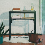 Minimalist black rattan console table with a sleek design and sturdy construction, perfect for adding functional elegance to any entryway or living space. Designed in Singapore, it features a balanced combination of form and function, offering ample surface space while maintaining a lightweight, airy aesthetic.