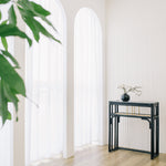 Minimalist black rattan console table with a sleek design and sturdy construction, perfect for adding functional elegance to any entryway or living space. Designed in Singapore, it features a balanced combination of form and function, offering ample surface space while maintaining a lightweight, airy aesthetic.